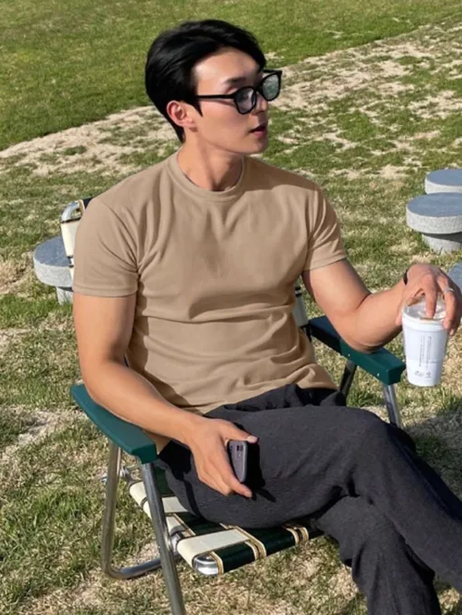 A high-quality beige men's plain t-shirt in a Korean-inspired style.
