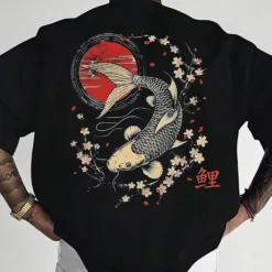 Man wearing a black oversize Koi fish t-shirt with traditional Japanese art style graphic on the back.